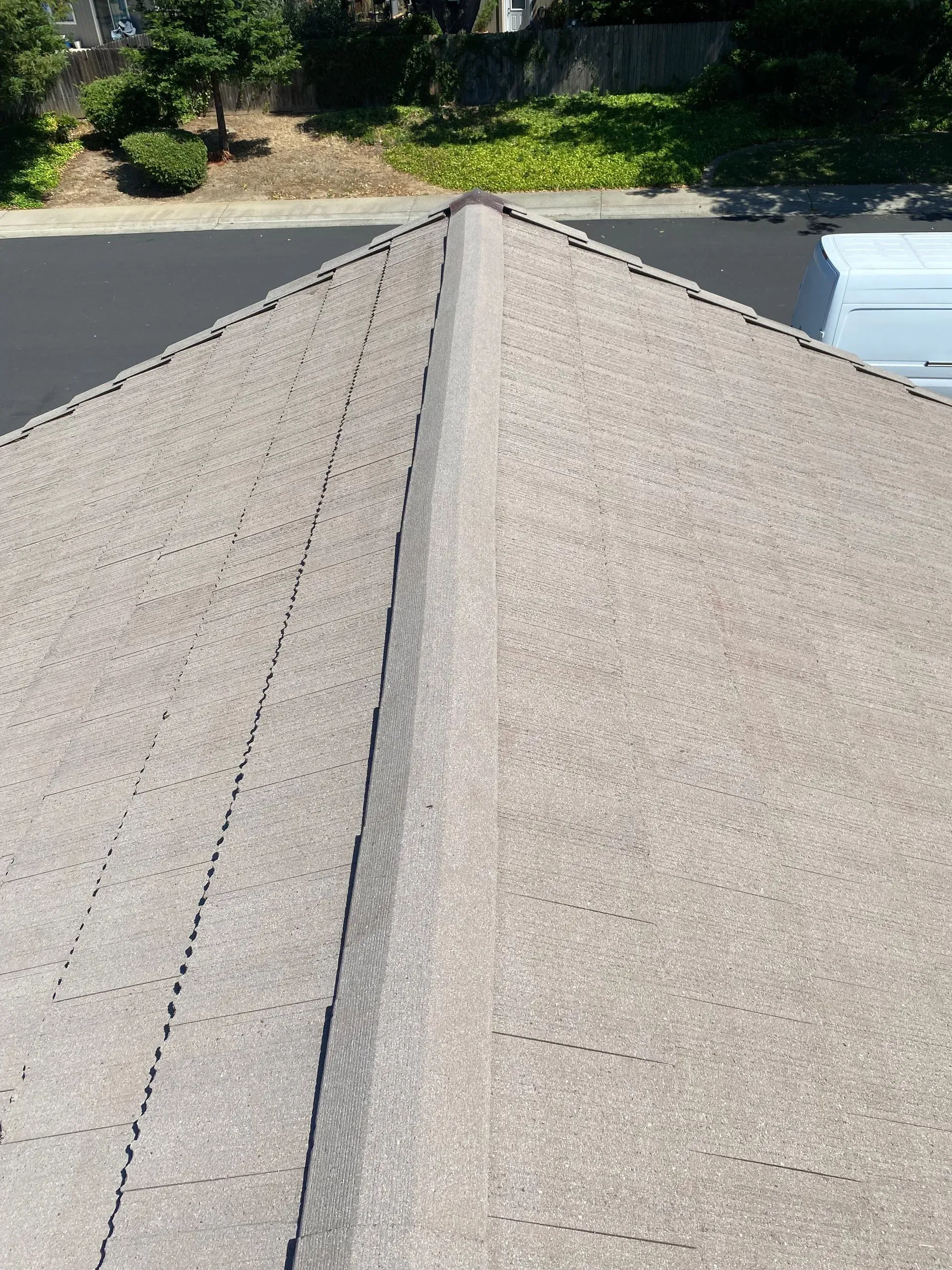 A close up of a roof with a black stripe on it