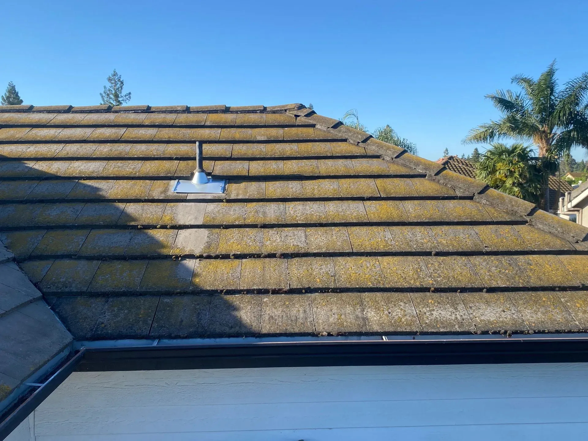 A close up of a roof with a antenna on it