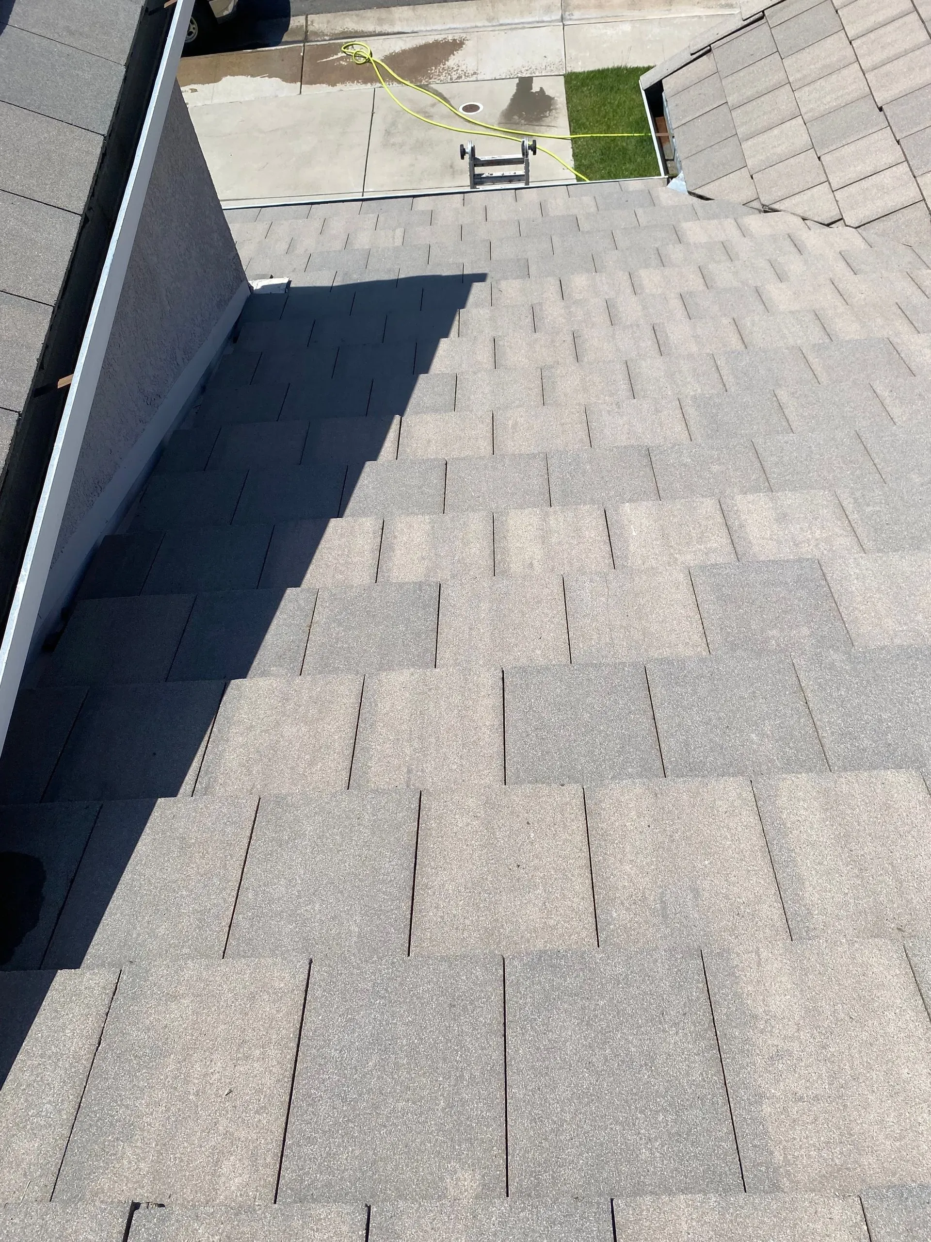 A ladder is attached to the roof of a building