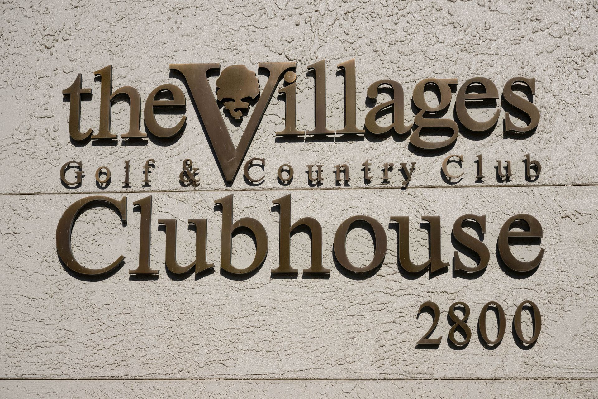 A sign for the villages golf and country club