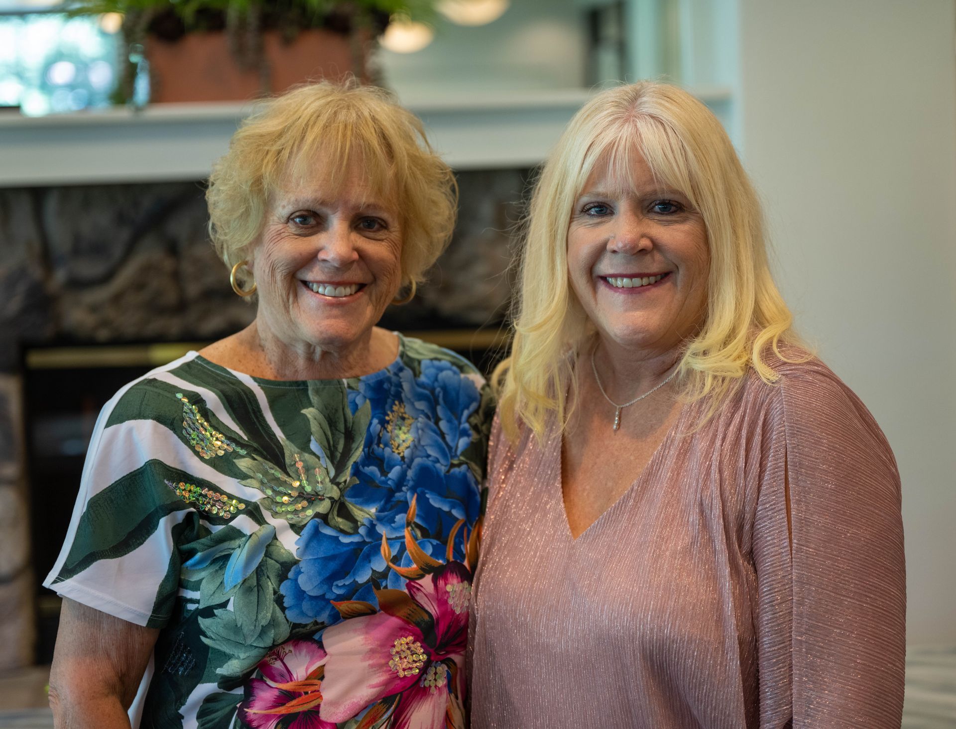 Kim Silverman and a women are standing next to each other and smiling for the camera.