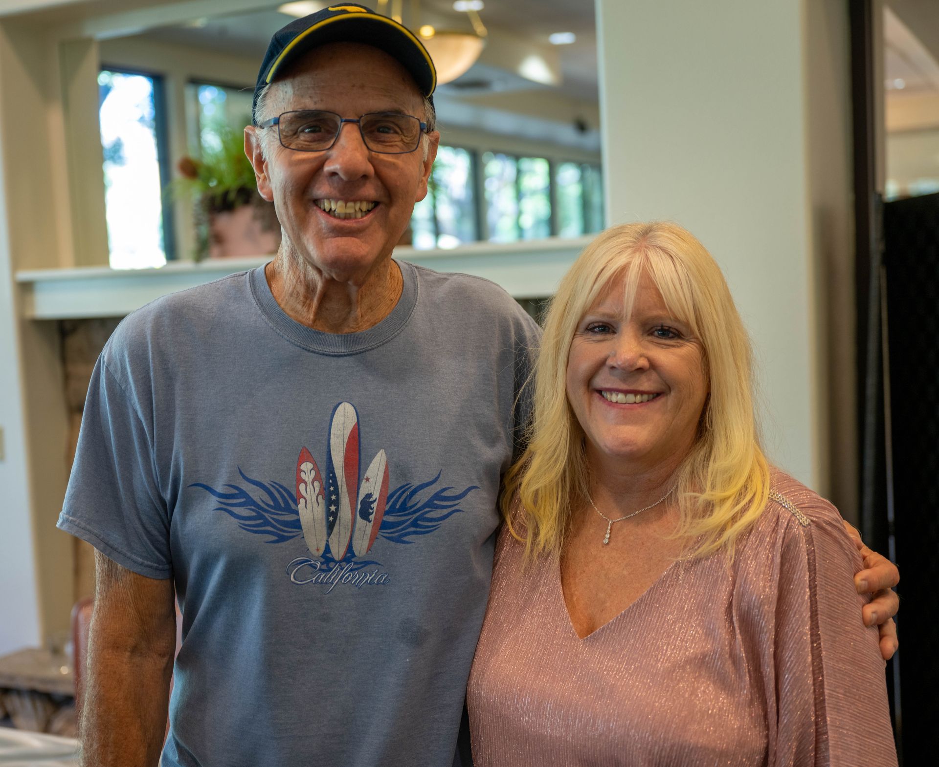 A man and Kim Silverman are posing for a picture together