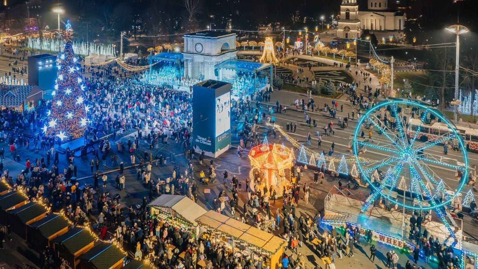 Winter holiday market in Chișinău featuring handmade crafts, warm drinks, and glowing decorations. 