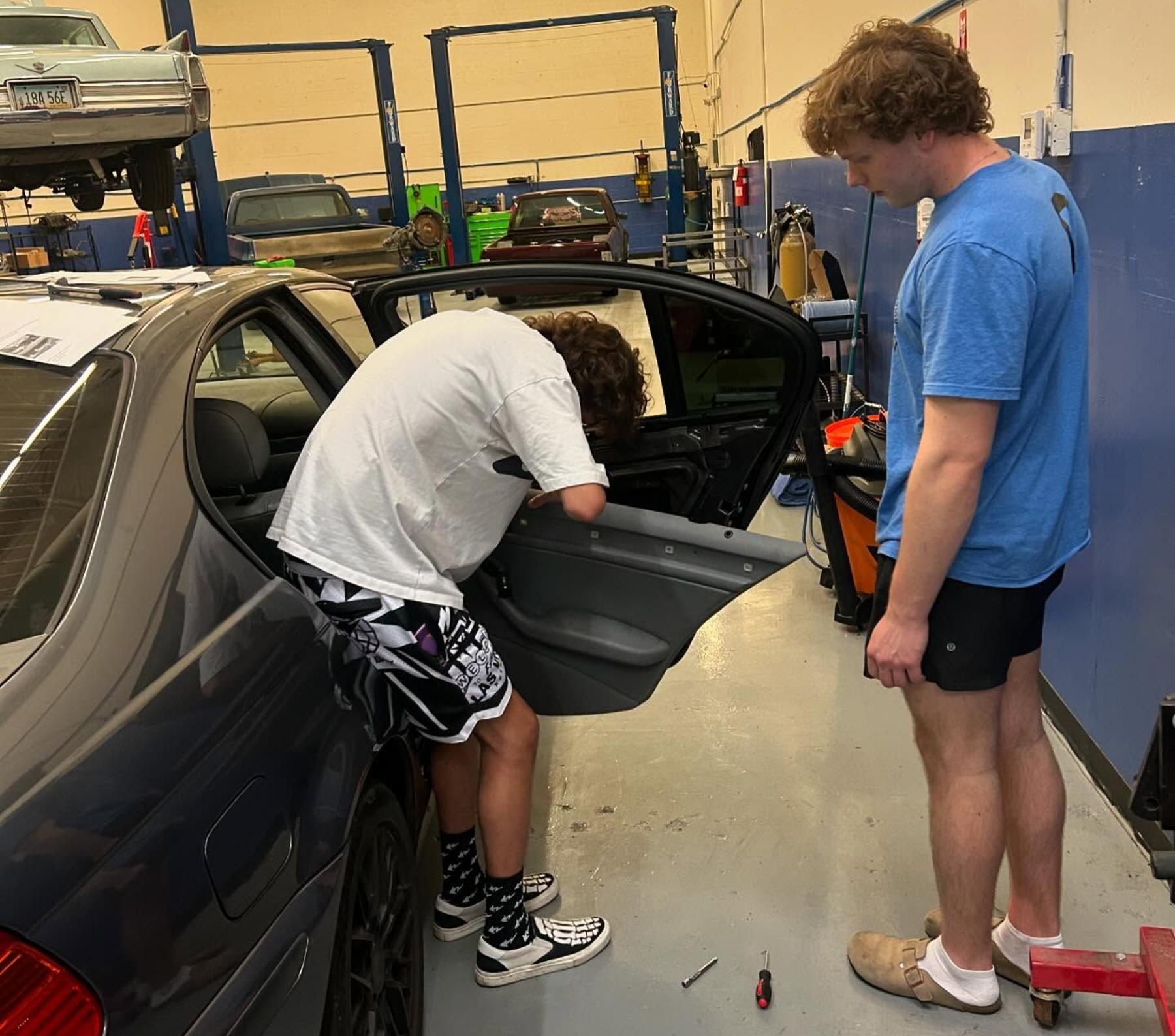 Technicians Inspecting Vehicle Interior During Diagnostic Work | Double D Automotive