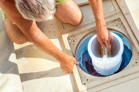 Man Cleaning Filtration System — Poolside Byron Bay in Byron Bay, NSW