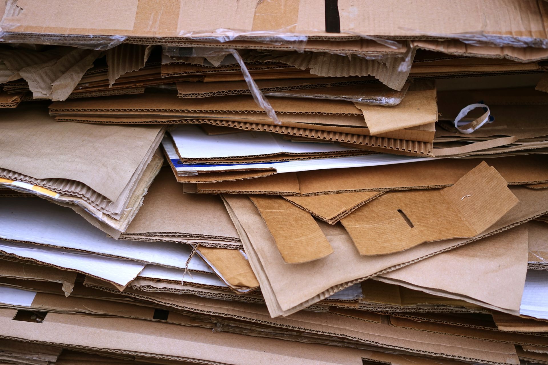 A pile of cardboard is stacked on top of each other