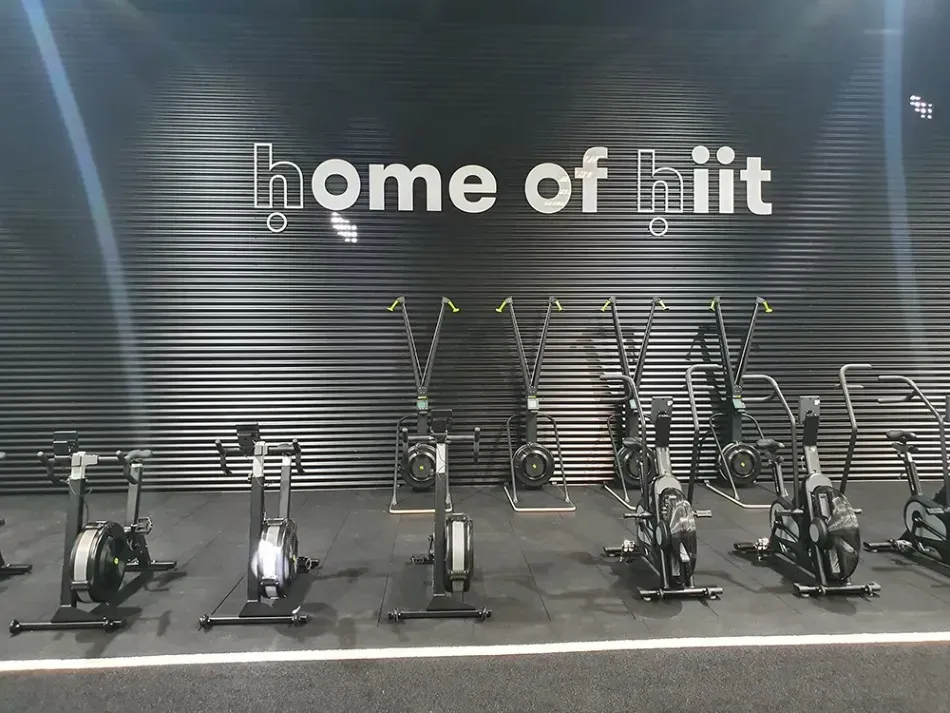 A gym with a sign that says home of hiit