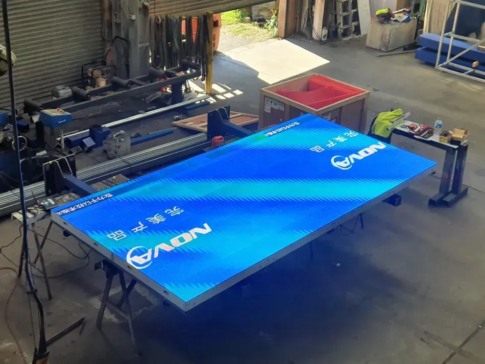 A large blue sign is sitting on top of a table in a room.