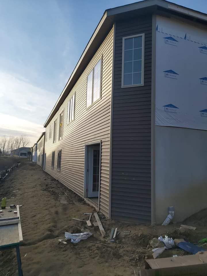 A large building with a lot of windows is being built.