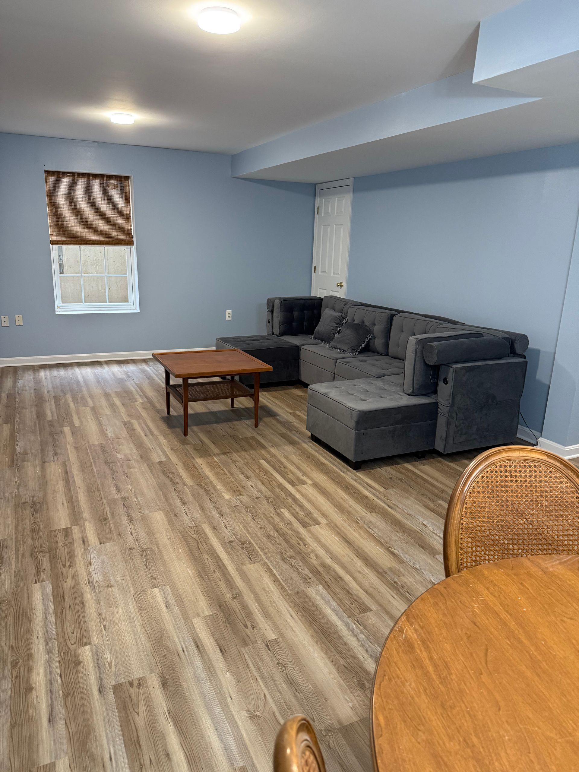 Image of  a furnished living room that just got a interior painting job done by GT Miler Home Solutions. 