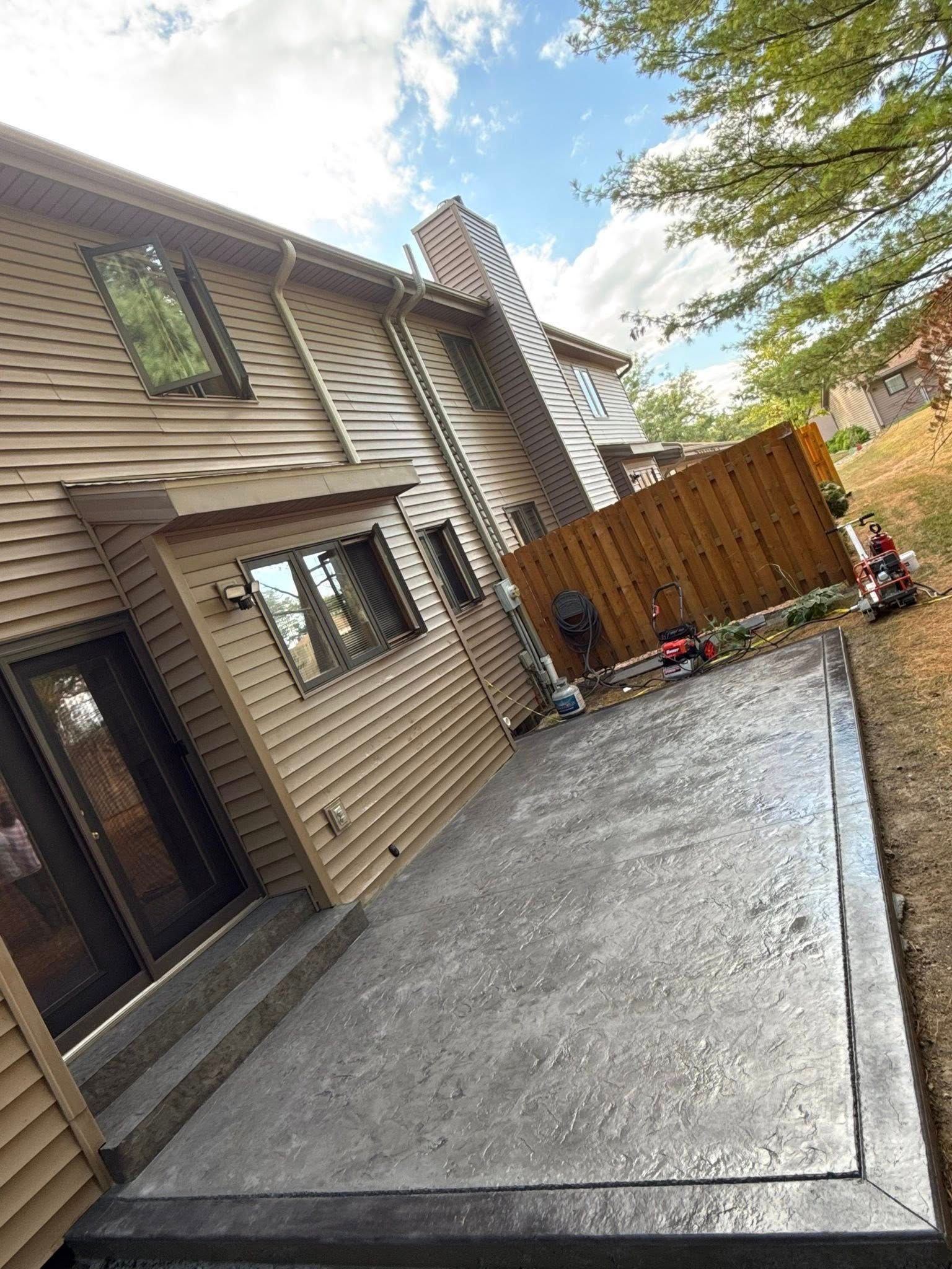 Brown rectangular concrete pavers arranged in a grid pattern.