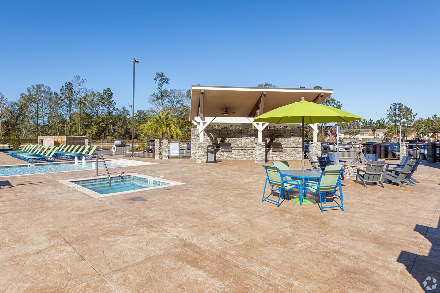 Outdoor seating and poolside cabanas at Waypoint at Hammond.