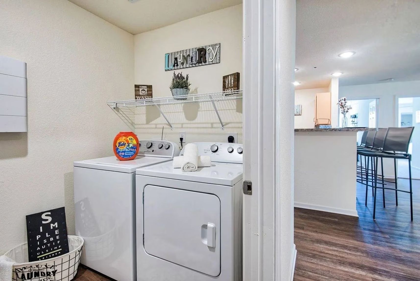 In-unit washer and dryer setup in Waypoint at Hammond apartments.