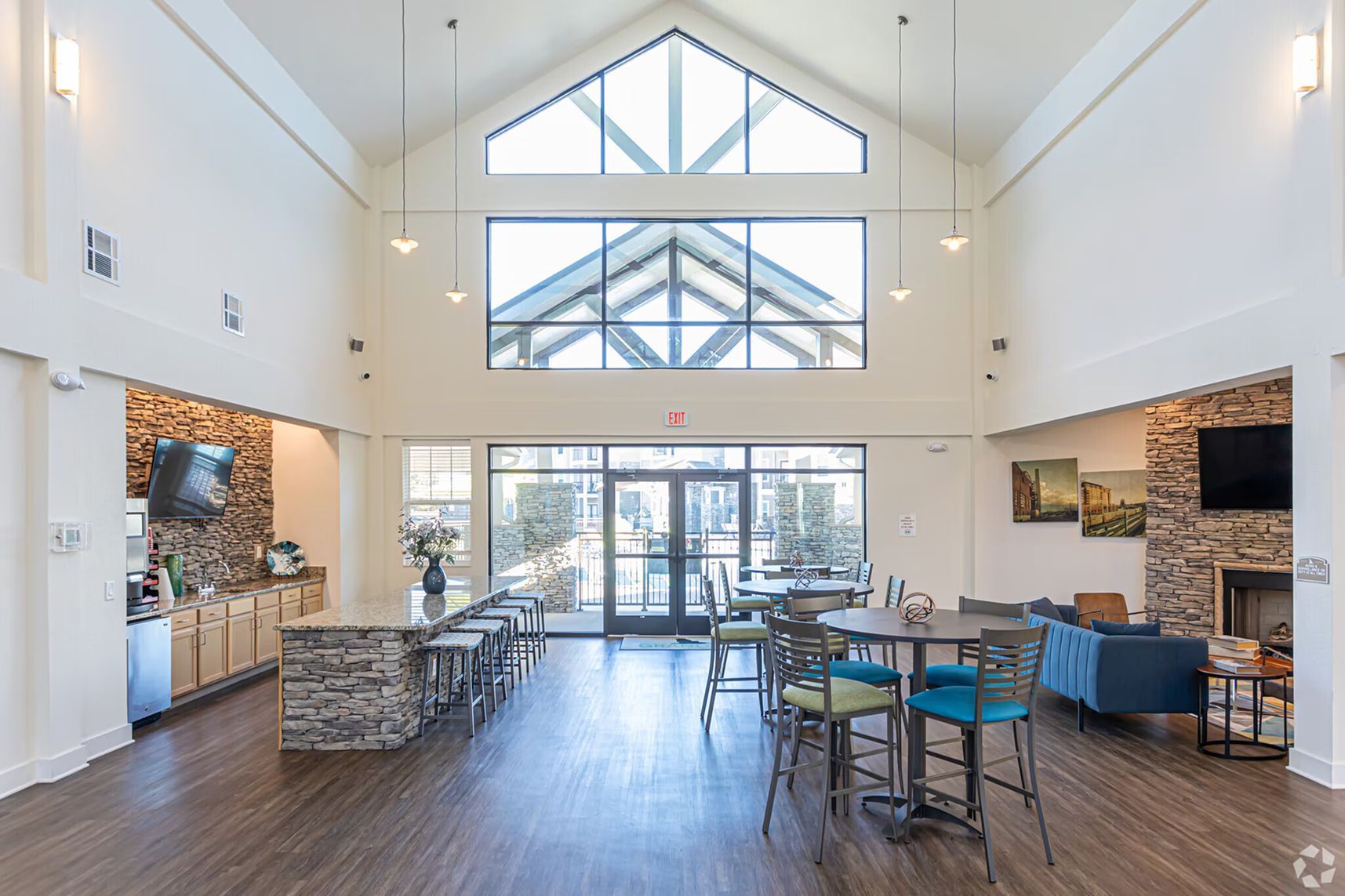 Spacious lobby with large windows, reception area, and gathering spaces at Waypoint at Hammond.