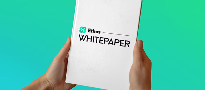 A person is holding a white paper in their hands.