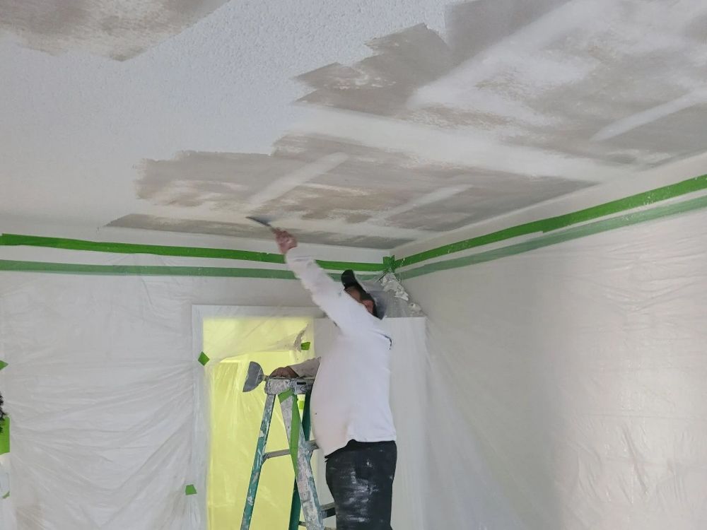 Man Cleaning Ceiling | Durham, NC | Exceptional Painting