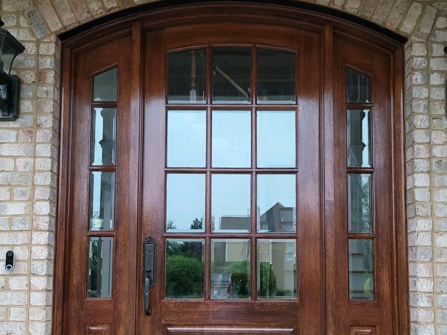 a wooden door with a brick wall behind it | Durham, NC | Exceptional Painting a wooden door with a brick wall behind it | Durham, NC | Exceptional Painting