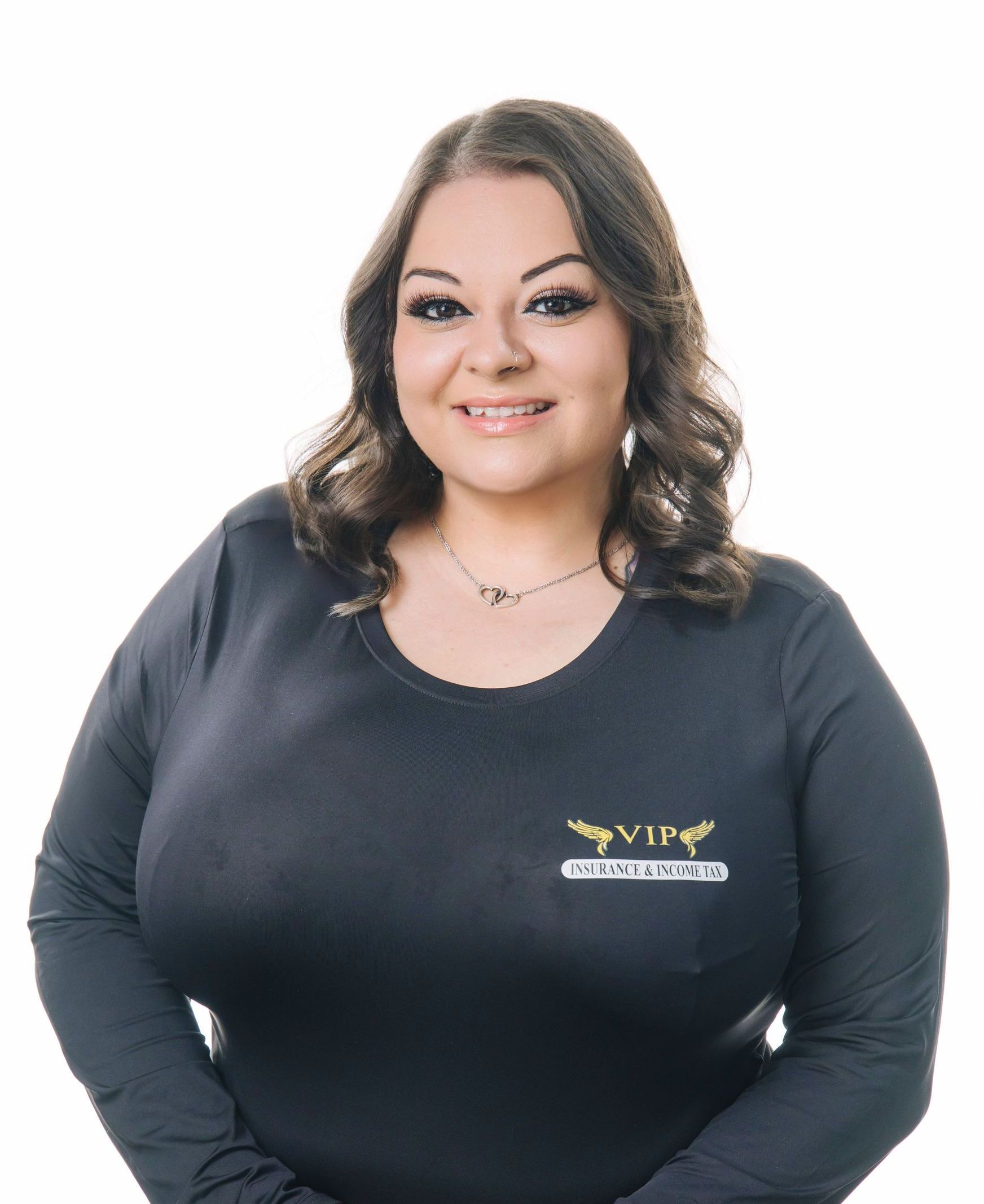 A woman wearing a white off the shoulder top and black jeans