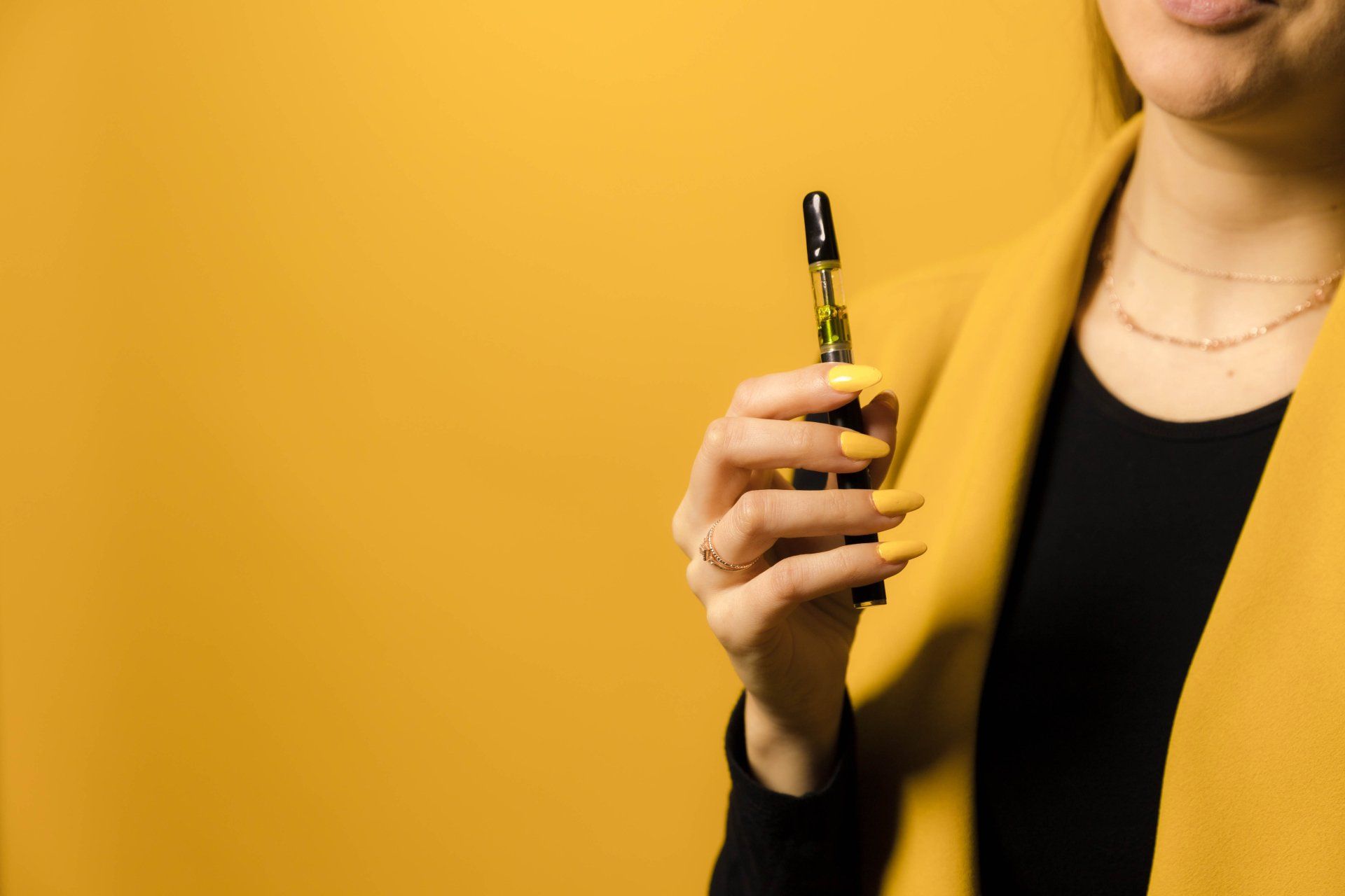 Vape pen in woman's hand