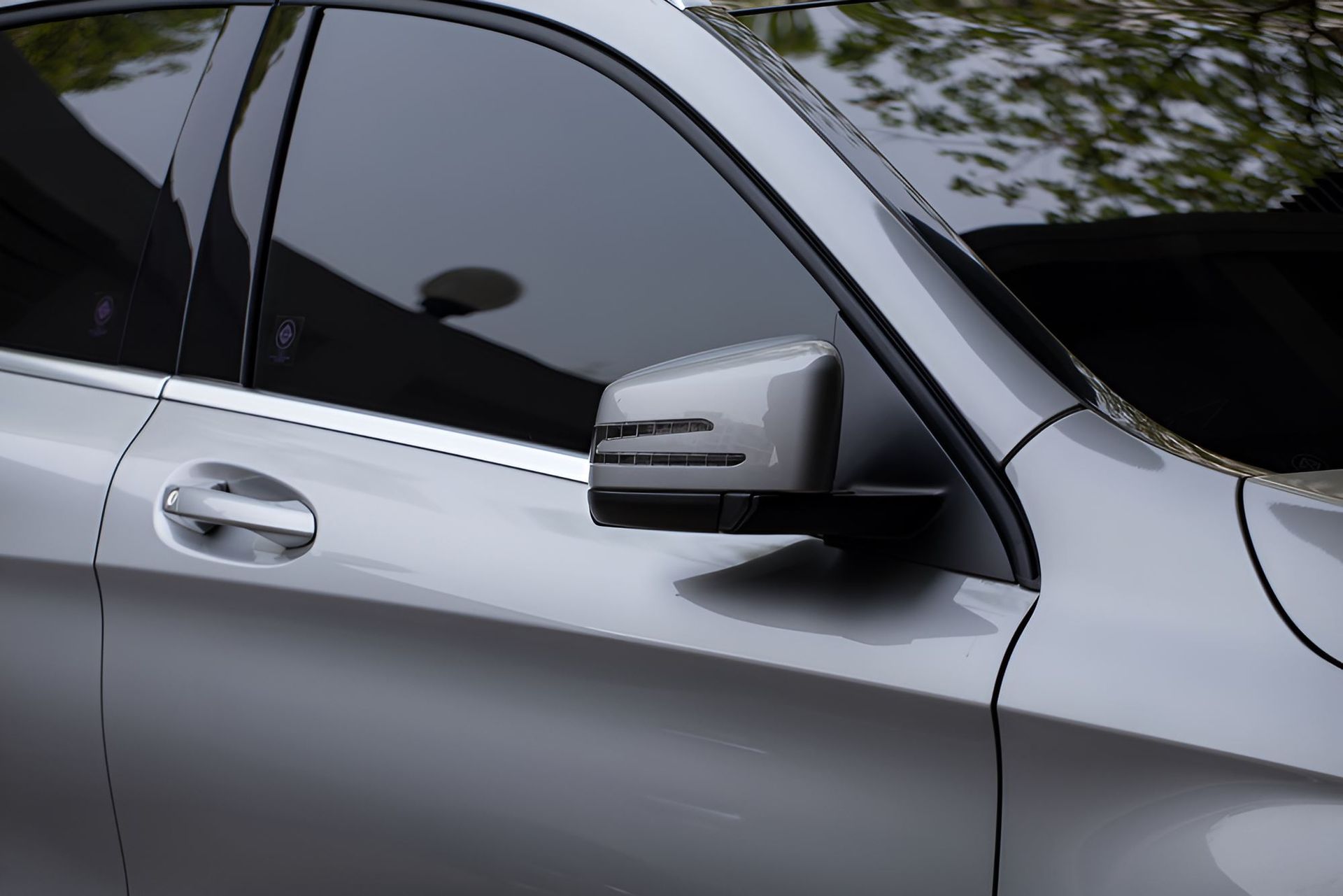 A Close Up of a Silver Car With a Black Side Mirror — C J Mechanical In Berry, NSW
