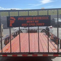 The back of a trailer with a sign on it that says `` perez bros rentals llc rent me ''.