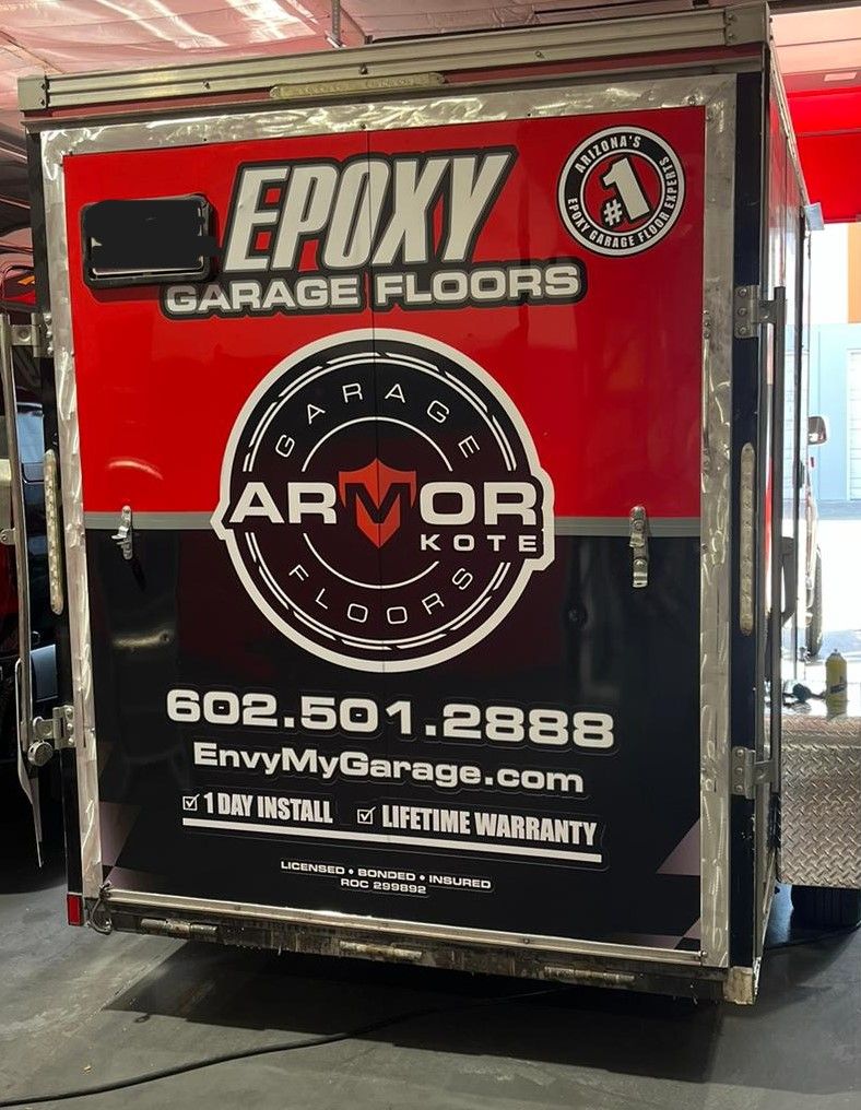 A trailer that says epoxy garage floors on it