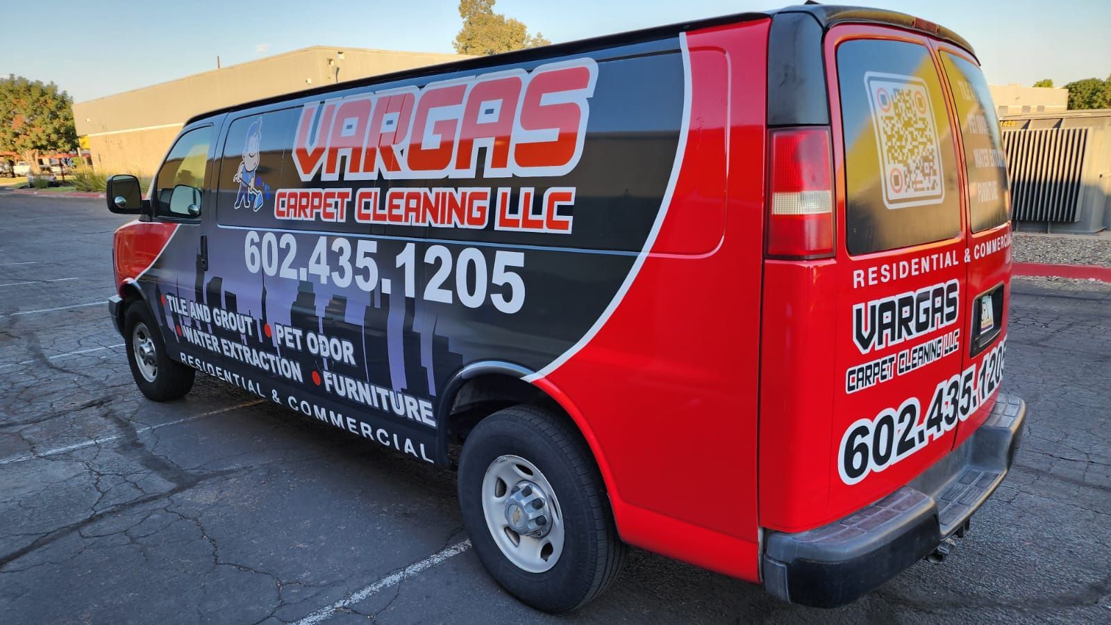 A red and black van with vargas written on the side