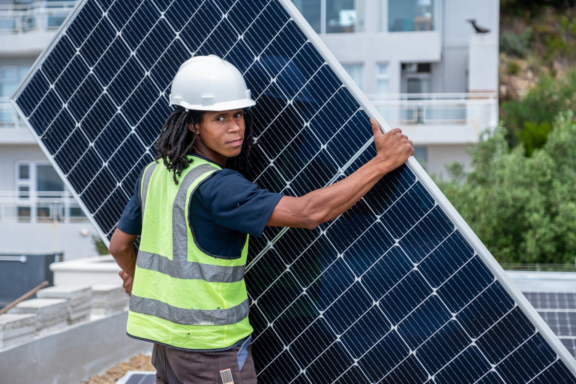 A Man with White Hard Hat Carrying a Solar Panel – Brisbane, QLD – Star Bright Energy