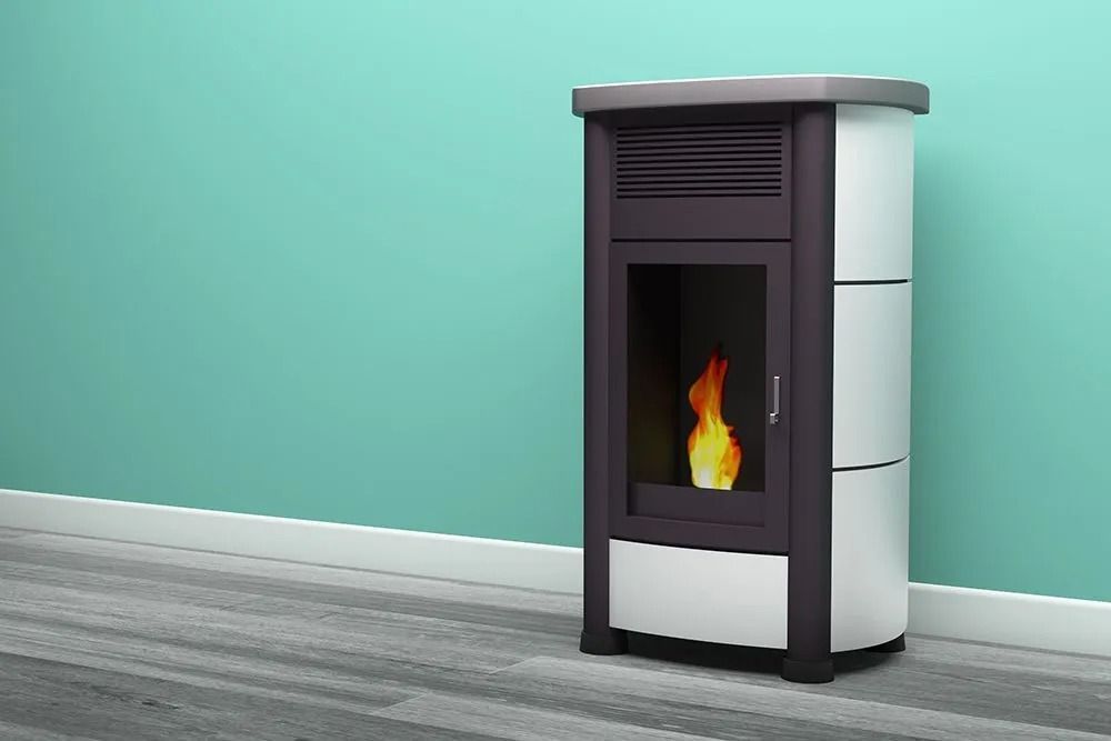 Pellet Stove With a Visible Flame, Against a Teal Wall and Gray Floor — Climate King In Orange, NSW