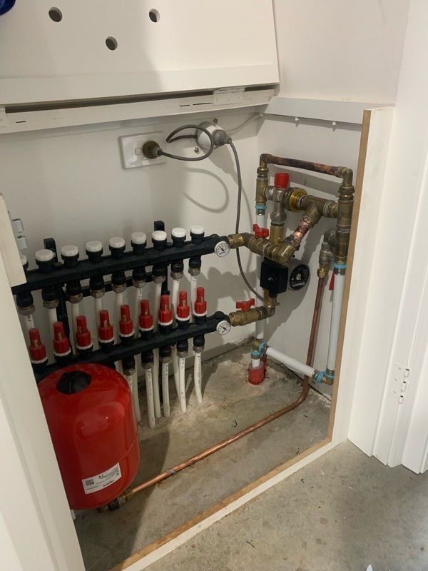 A White Cabinet Houses a Hydronic Heating System — Climate King In Orange, NSW