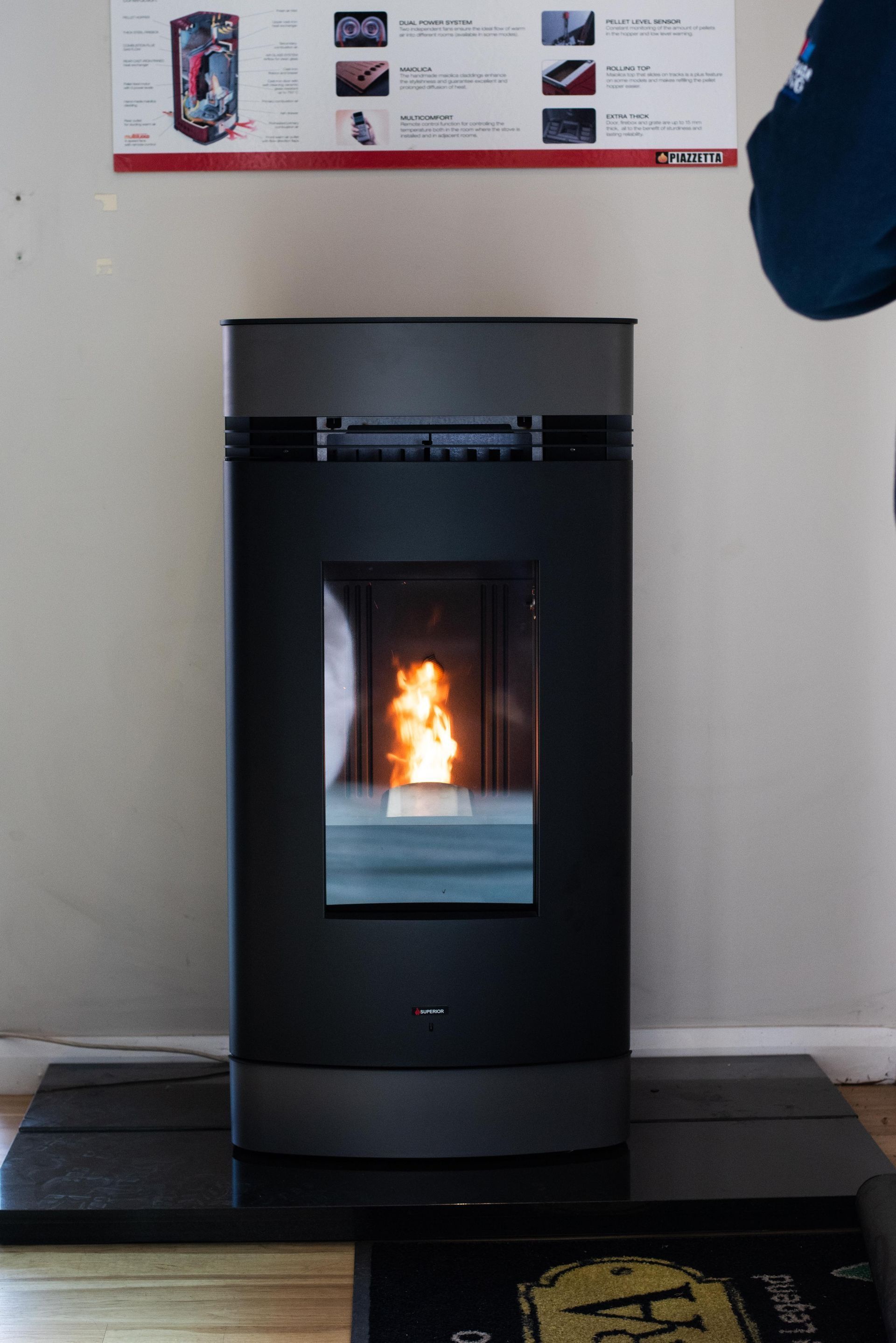 A Dark Pellet Stove With a Glowing Fire Visible — Climate King In Orange, NSW