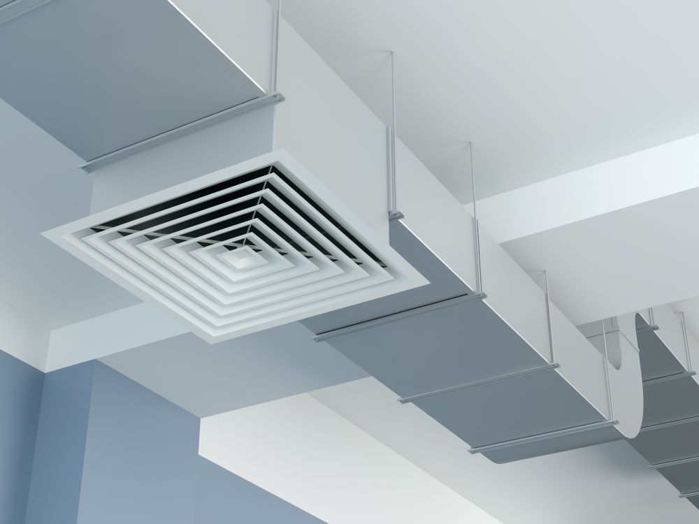 White Air Vent and Ductwork on a Ceiling, Blue and White Wall Background — Climate King In Dubbo, NSW