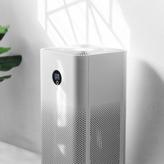 White Air Purifier With Digital Display, Indoors Near a Plant — Climate King In Bathurst, NSW