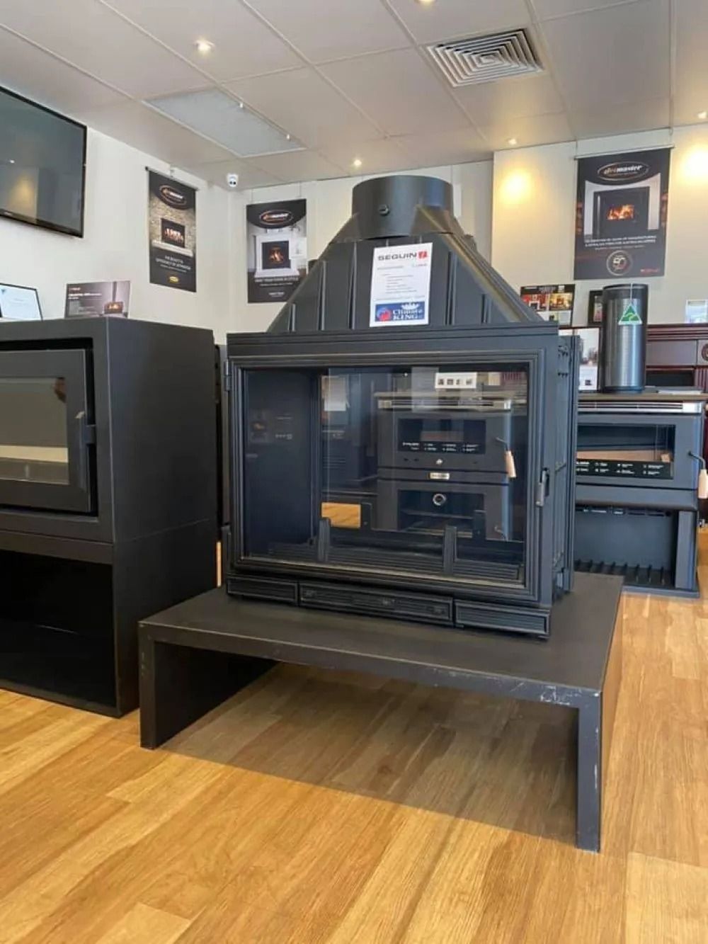 Black Fireplace on a Stand in a Showroom — Climate King In Orange, NSW