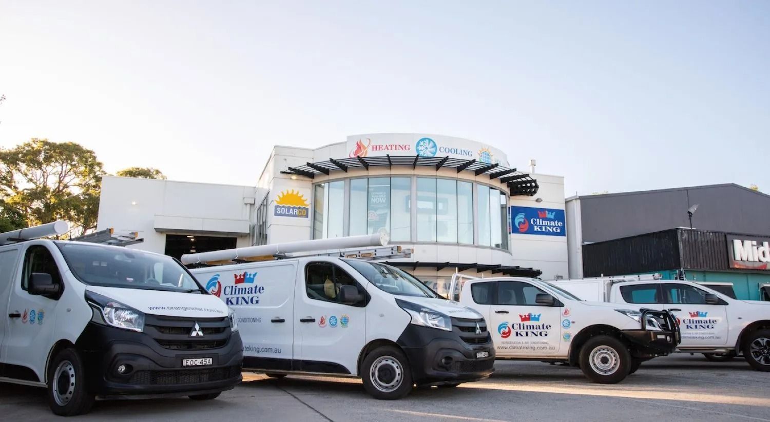 Four White Service Vans Parked in Front — Climate King In Orange, NSW