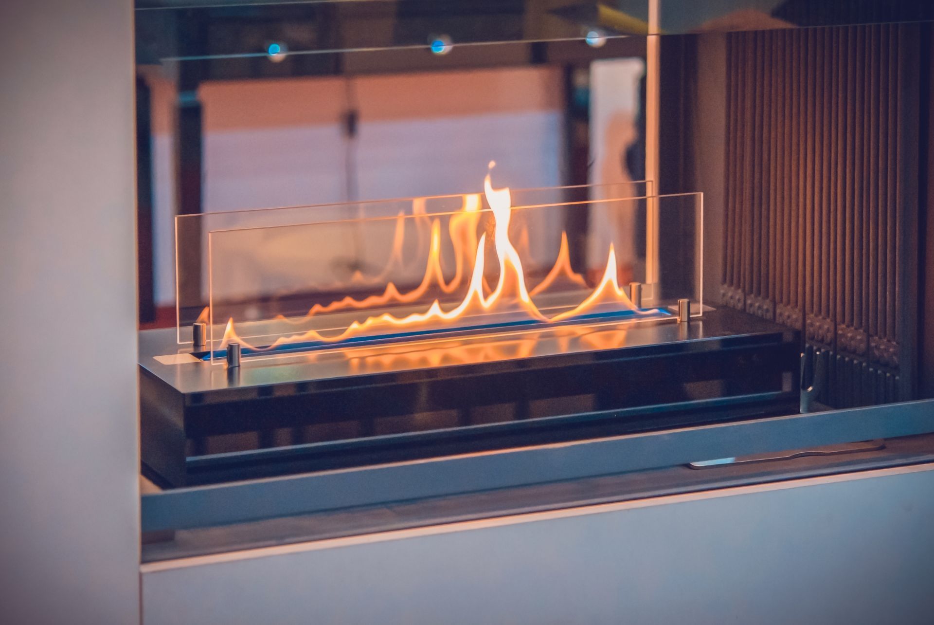 Modern Fireplace With Bright Orange Flames Behind Glass Panels — Climate King In Orange, NSW