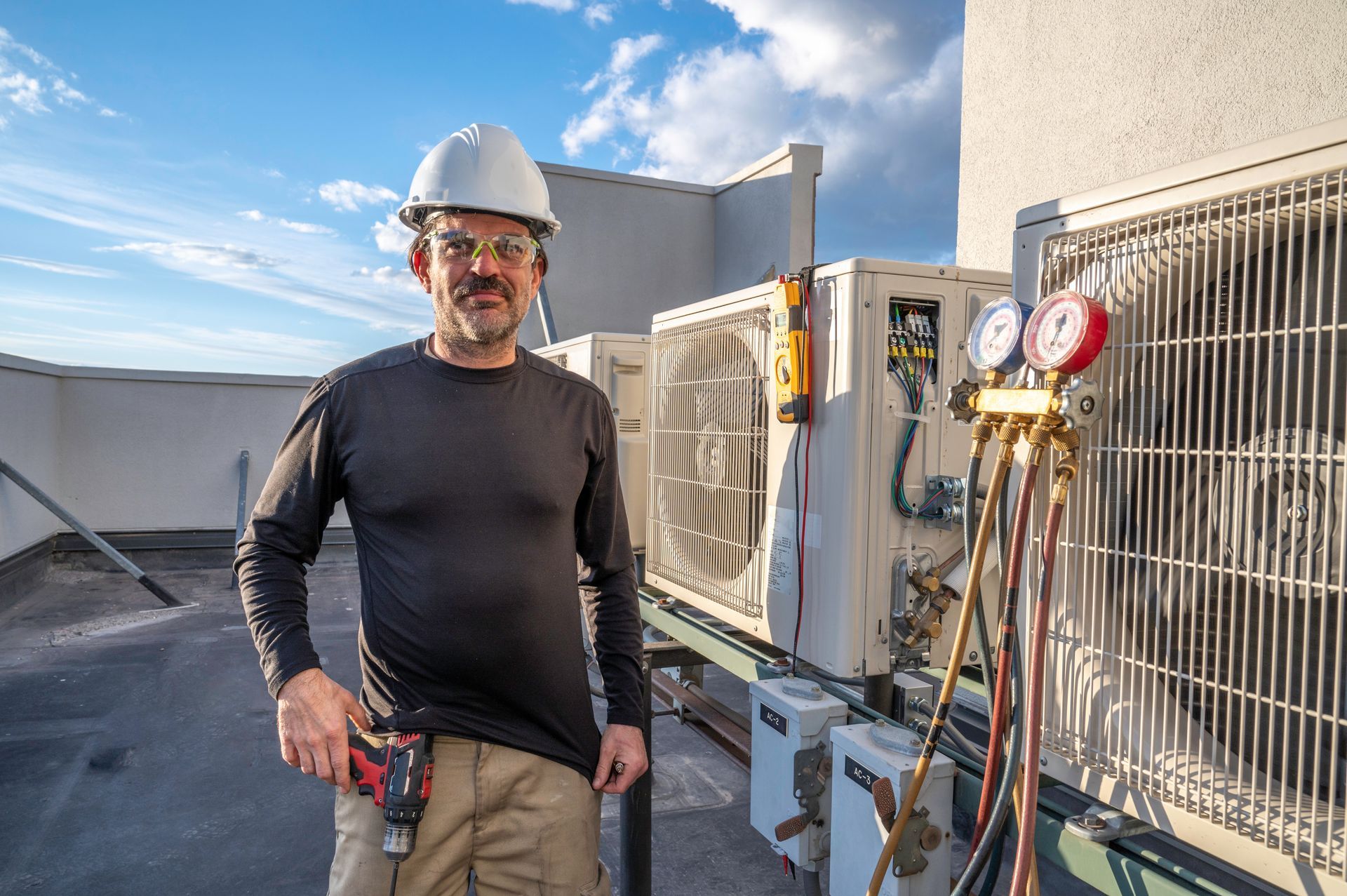 Hvac Technician in Hard Hat on Rooftop, by AC Units — Climate King In Orange, NSW