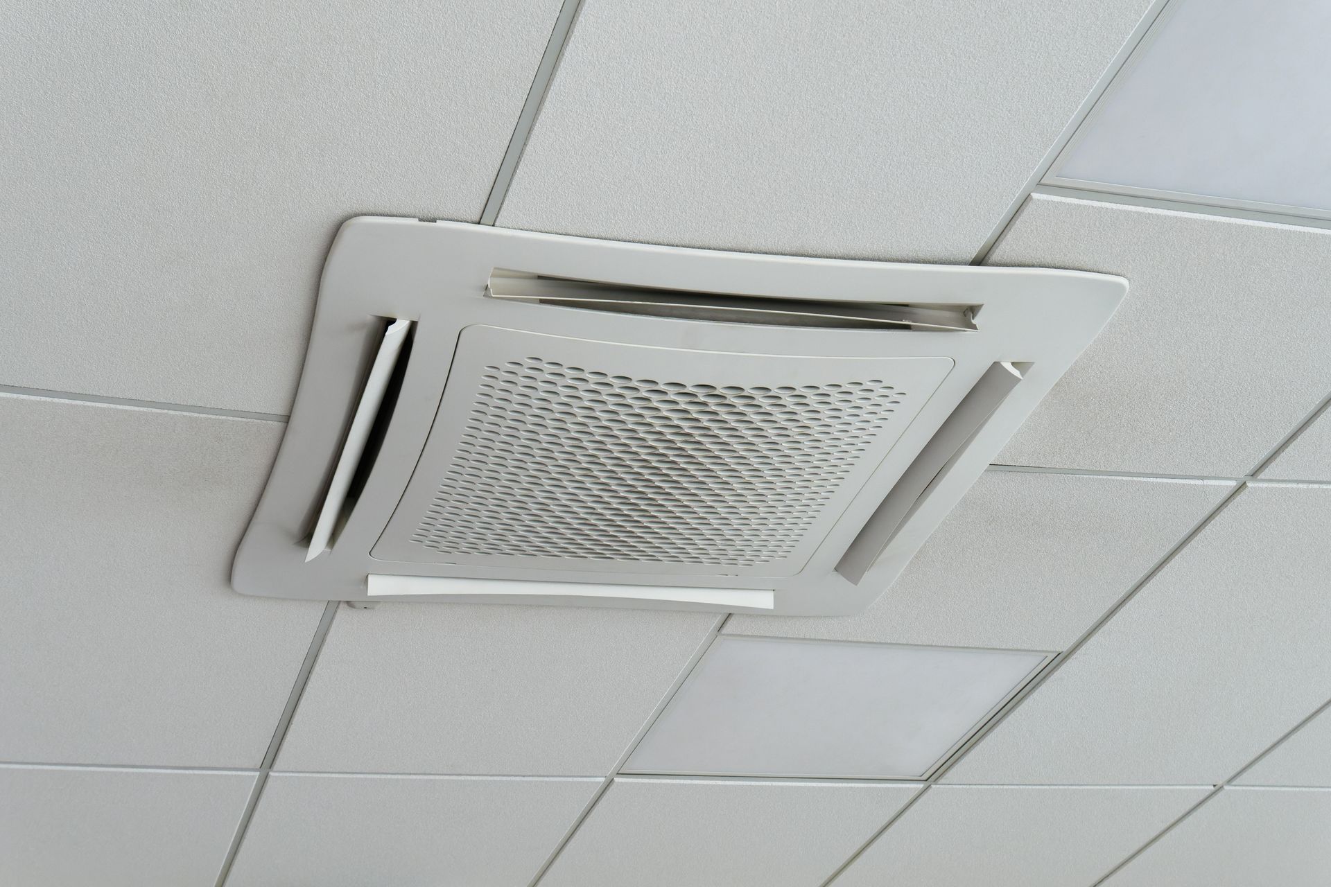 White Ceiling Air Conditioner Vent Panel Installed in a Grid Ceiling — Climate King In Orange, NSW
