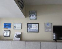 There are a lot of plaques on the wall in this room.