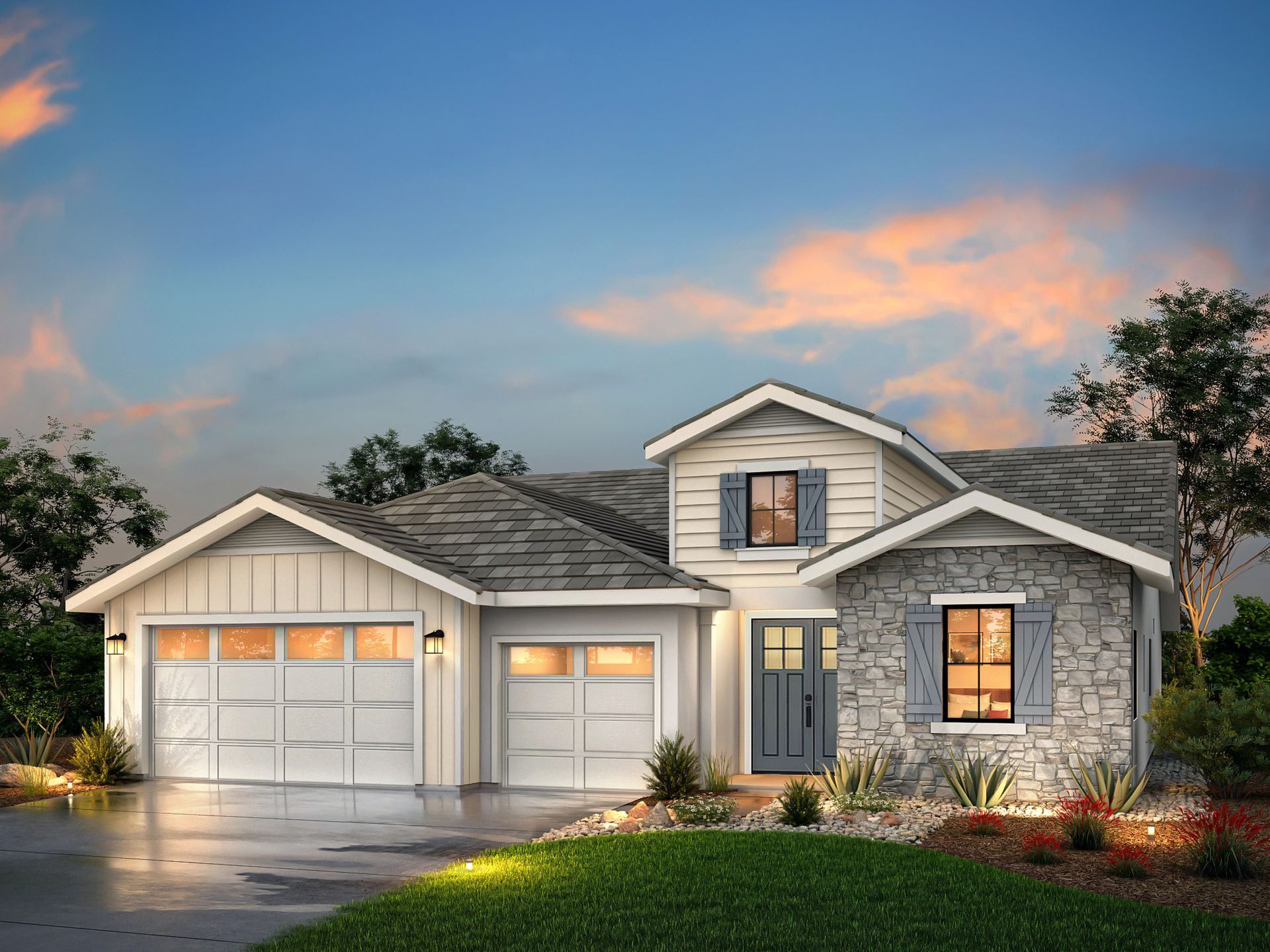 House exterior, two-car garage, stone facade, blue door, white siding, and gray roof at sunset.
