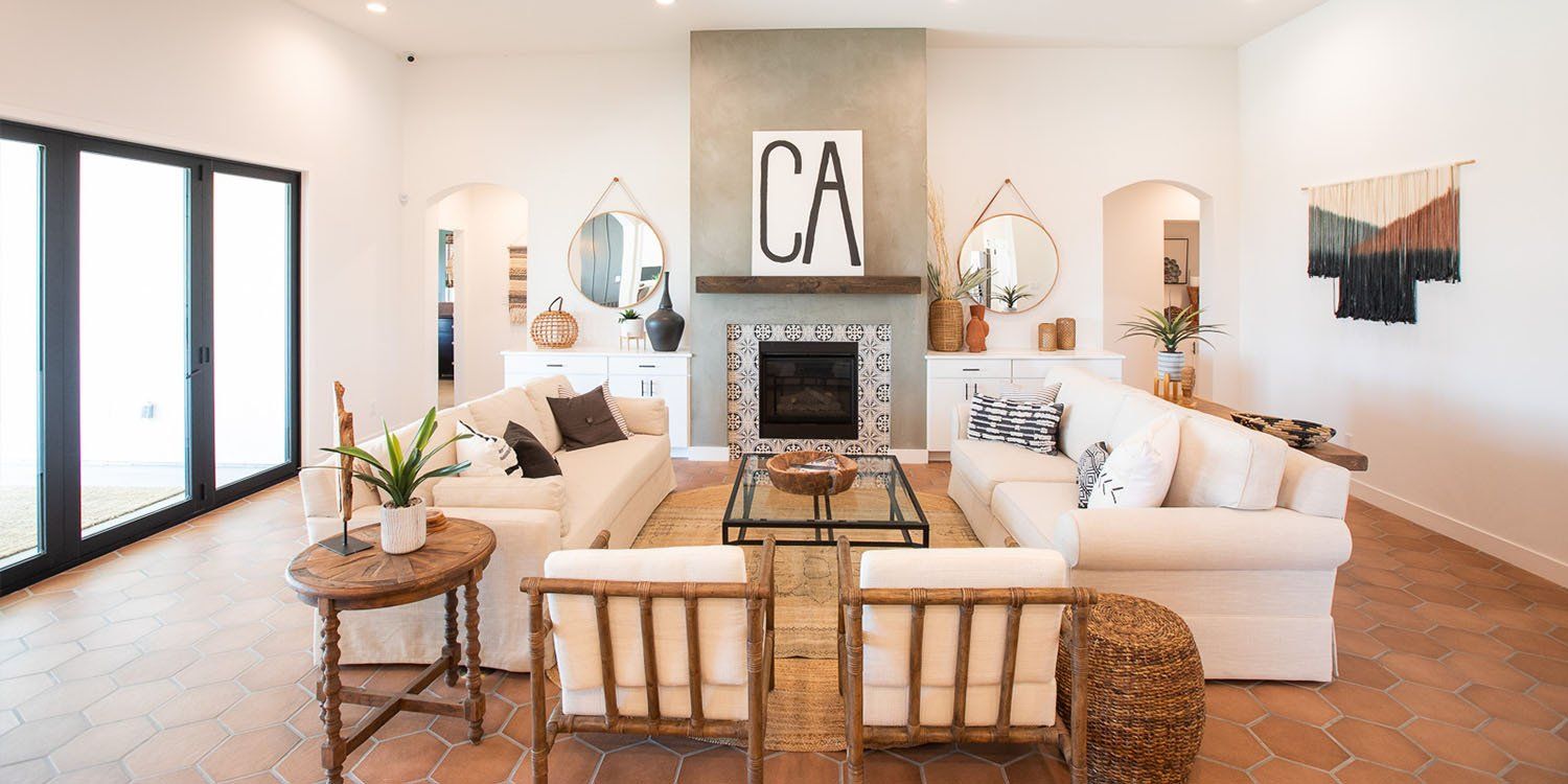 A living room filled with furniture and a fireplace.