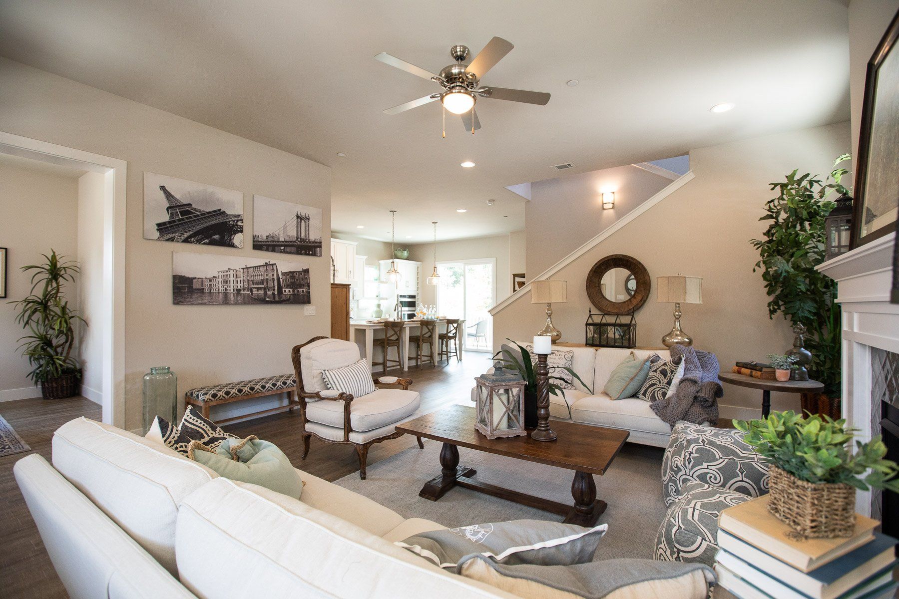 A living room filled with furniture and a ceiling fan.