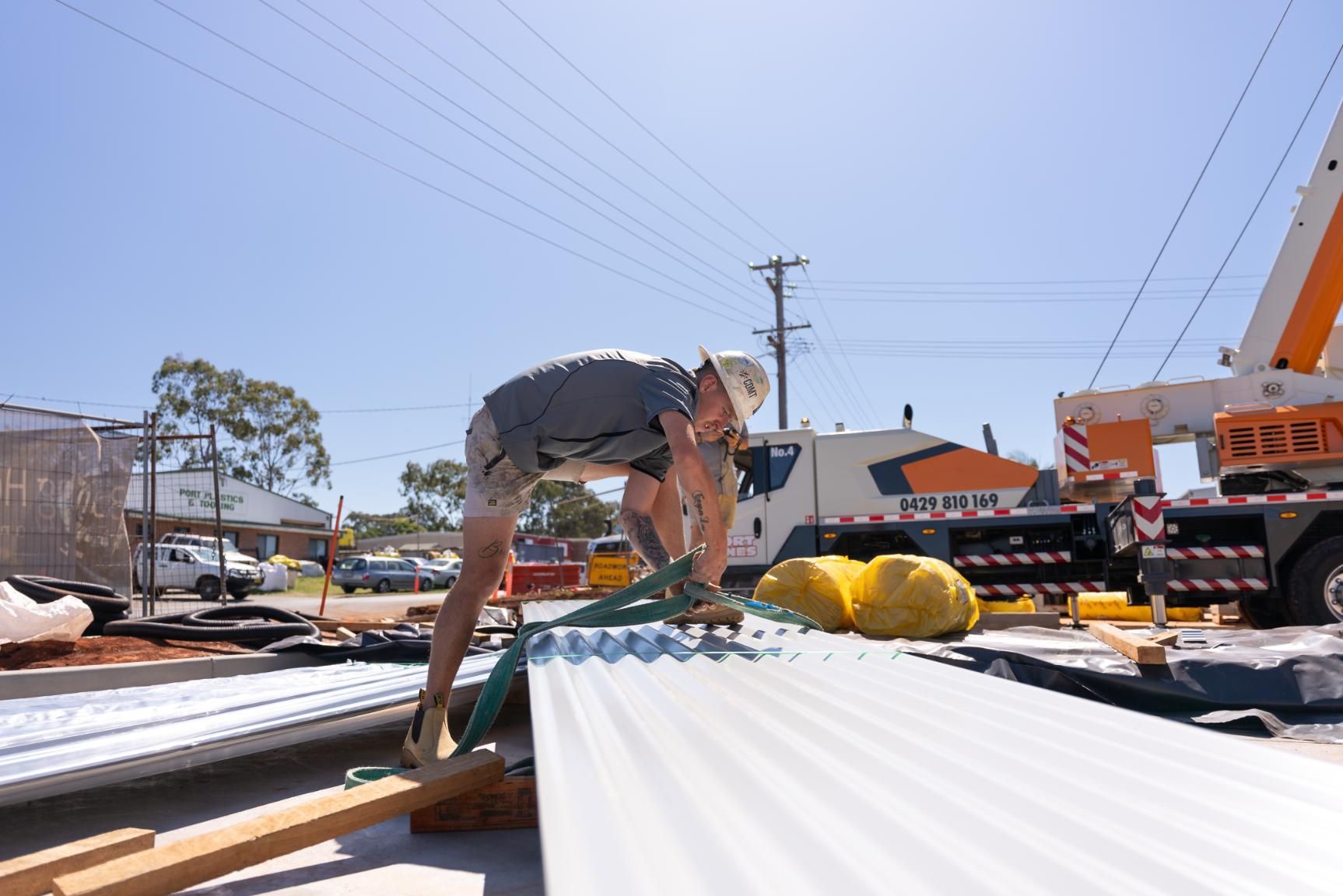 House Under Construction in a Residential Area Surrounded by Trees — Roofing Contractor in Wauchope, NSW