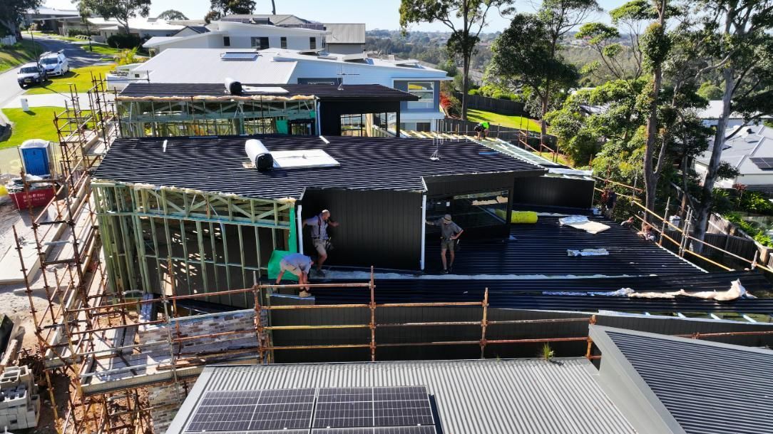 House Under Construction With Solar Panels on the Roof — Roofing Contractor in Forster, NSW
