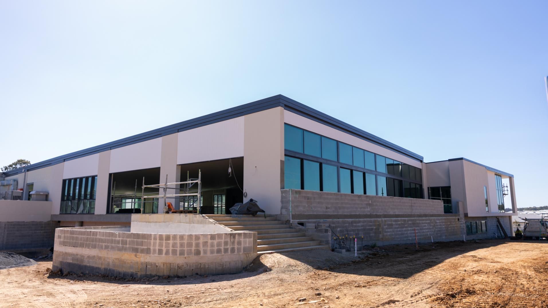 Brand New Built Building Window Glass — Roofing Contractor in Taree, NSW