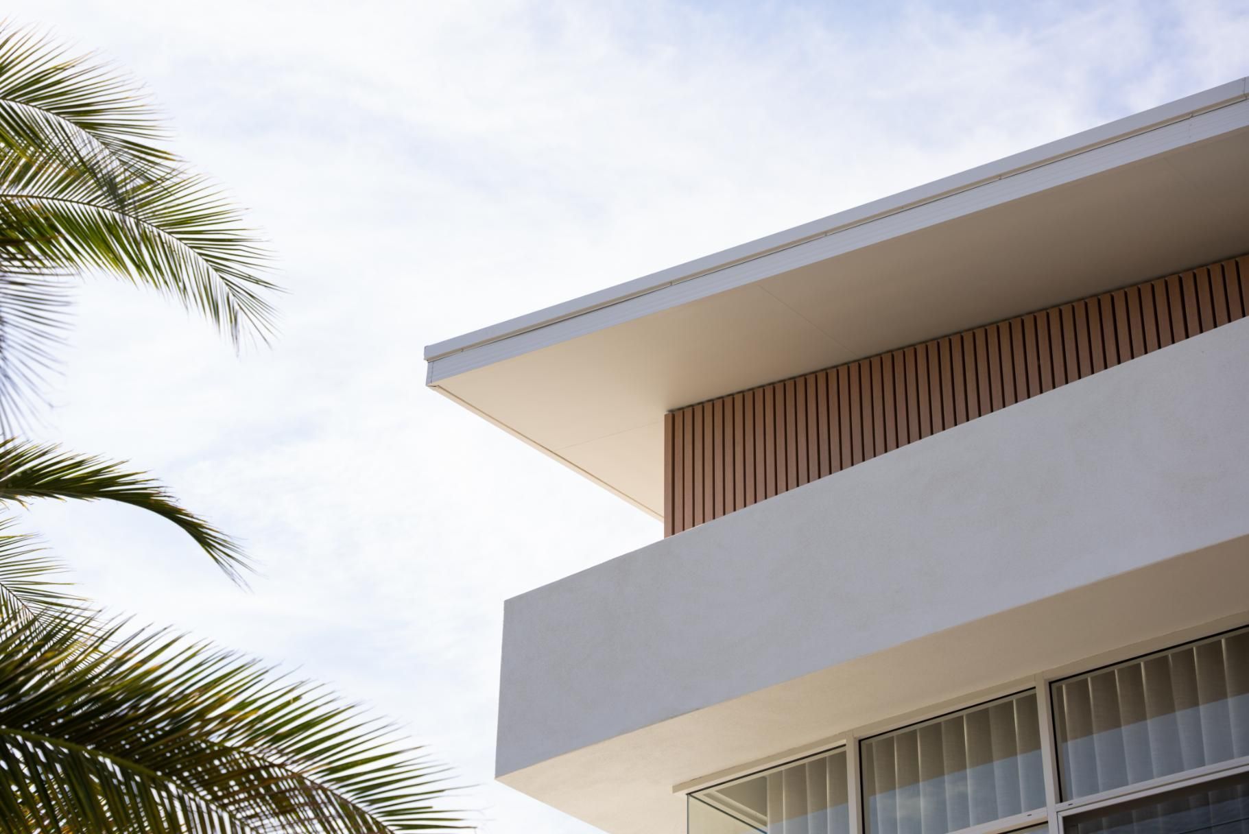An Aerial View of a Building With a Solar Panel on The Roof — Roofing Contractor in Wauchope, NSW