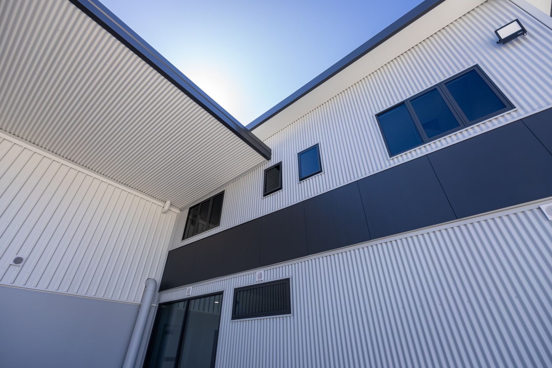 Construction Workers are Working on The House Roof — Roofing Contractor in Wauchope, NSW