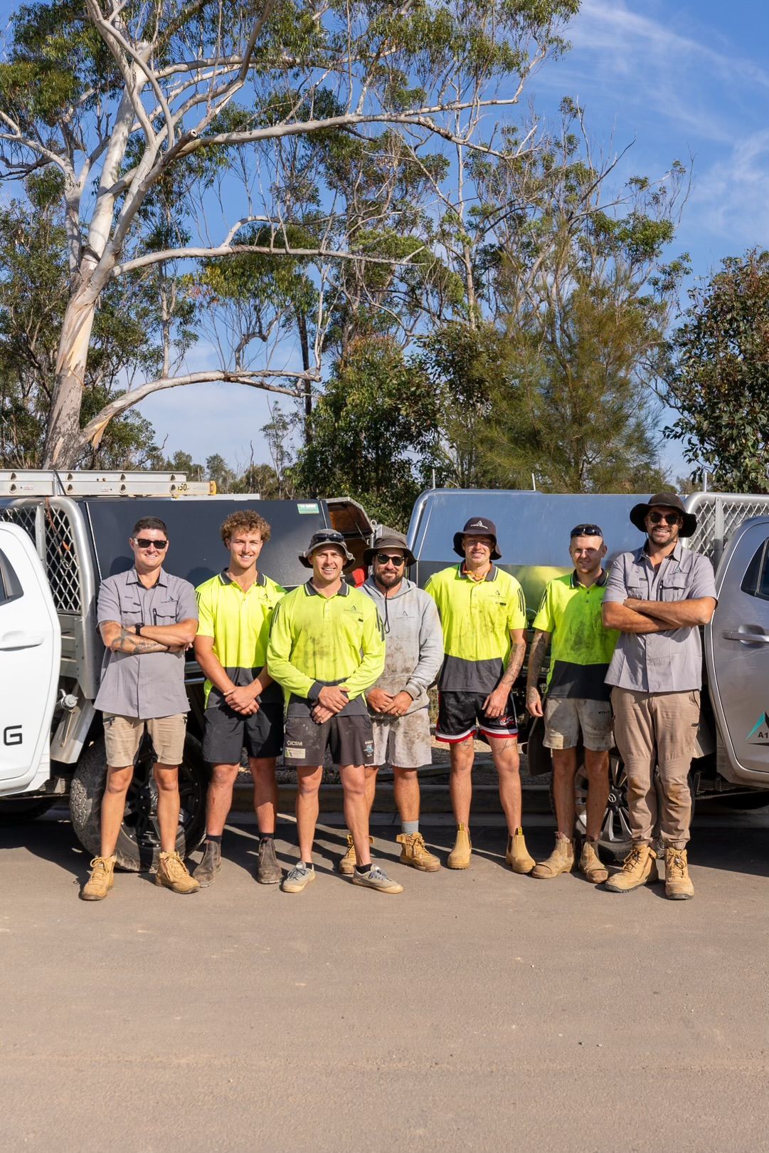 A Group of Men Are Standing on the Roof of a House — Roofing Contractor in Wauchope, NSW