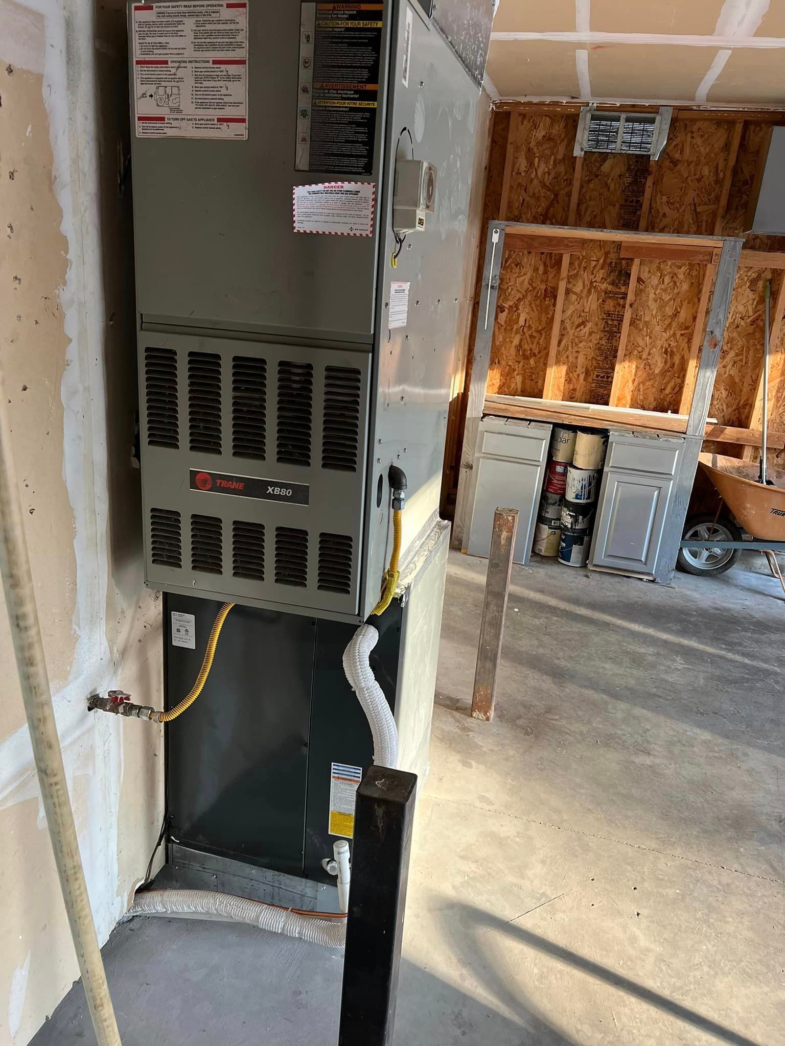 A picture of an air conditioner in a house under construction.