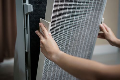 A Person Is Holding A Filter In Their Hands - Maricopa, AZ - Eco Mechanical LLC A Person Is Holding A Filter In Their Hands - Maricopa, AZ - Eco Mechanical LLC